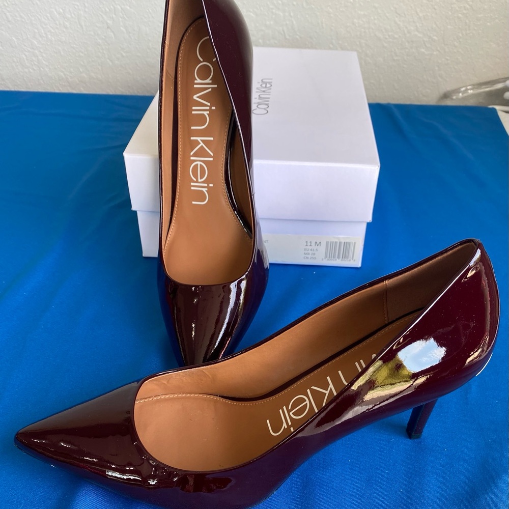 Calvin Klein pumps, patent leather, size 11.  Dark burgundy (Oxblood) color